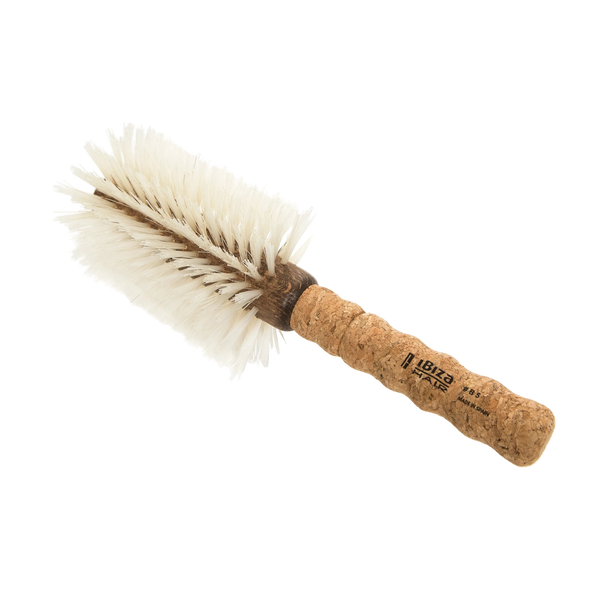 Cork brush with bristles on a white background