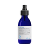 Blue bottle with a black cap on a white background
