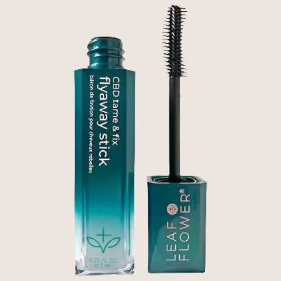 Leaf and Flower Tame & Fix Flyaway Stick, a remarkable CBD hair product in a teal tube with a brush applicator, provides excellent frizz control. Packaging showcases the text "NEW!" at the top left corner.