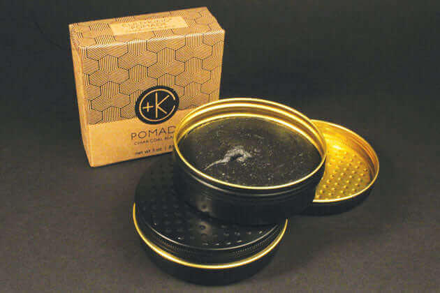 Four Cult and King POMADE CHARCOAL BLACK tins with gold lids.