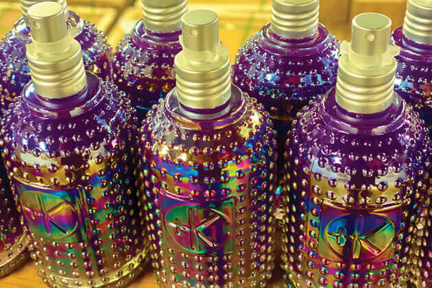 Cult and King SETSPRAY | Botanically Infused Wonderworking Hairspray bottles on a shelf.