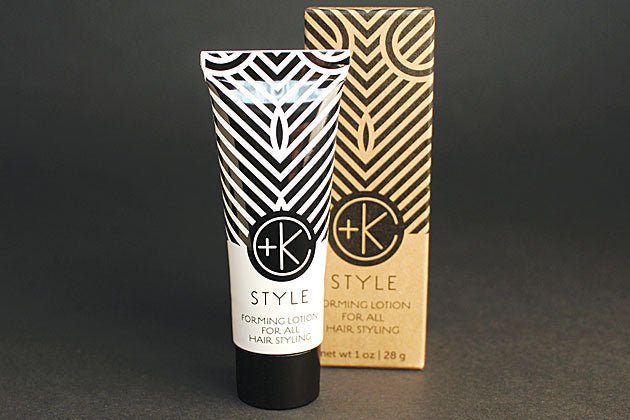 A tube of Cult and King STYLE | Forming Lotion for all Hair Styling on a black surface.