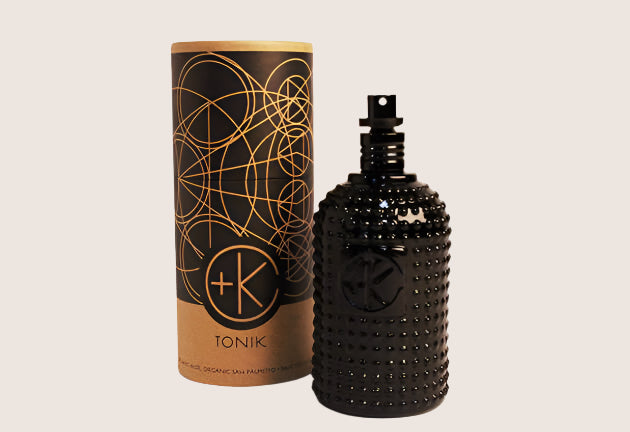 A black bottle of Cult and King TONIK | Conditioning Hair & Scalp Potion with a box next to it.