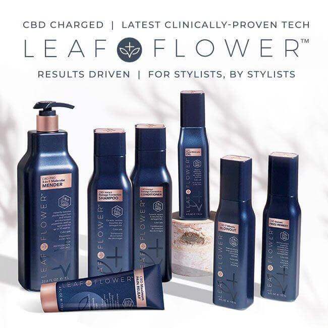 A collection of Leaf and Flower products with a plant-based formula, including color-safe shampoo, Damage Correction Conditioner (multiple sizes), treatment, styling items, and body lotion arranged elegantly on a light surface.