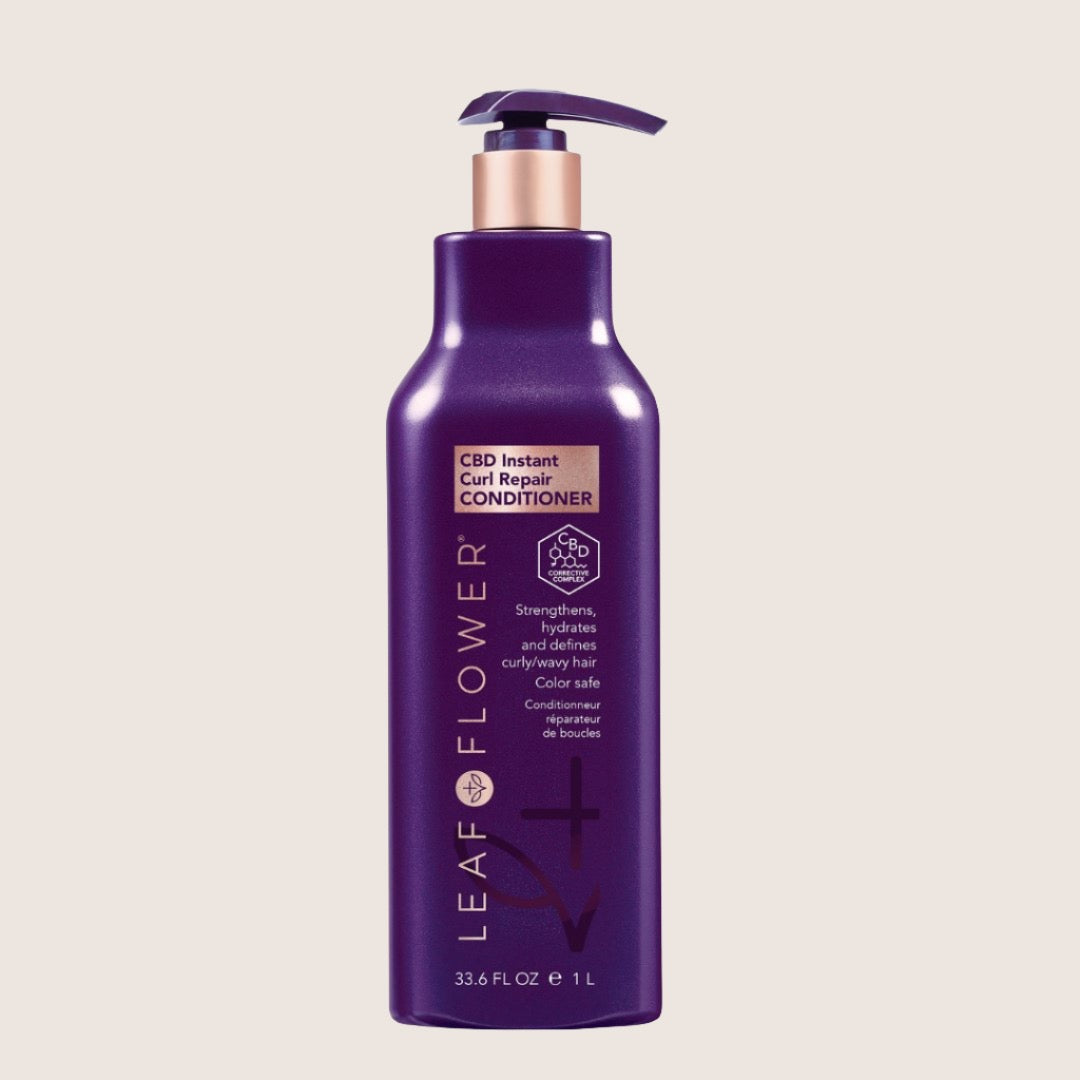 The purple bottle of Leaf and Flower Instant Curl Repair Conditioner with a pump top provides moisture replenishment and frizz reduction in every 33.6 fl oz.