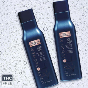 Two blue bottles of Leaf and Flower Instant Damage Correction Shampoo & Conditioner Duo (12 fl oz/350 ml each) with natural ingredients sit on a wet surface. A "THC Free" label is visible in the lower left corner.