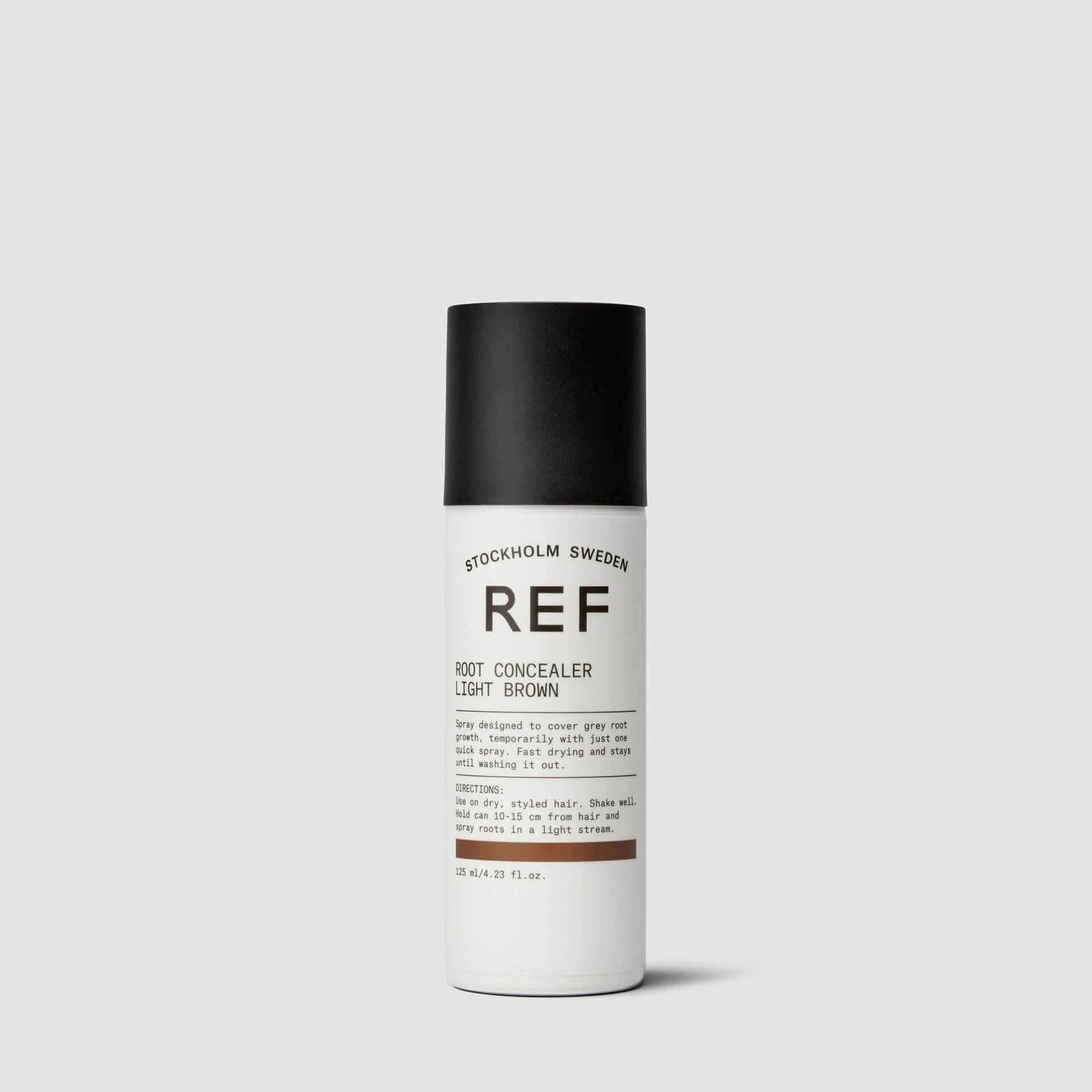 A bottle of REF STOCKHOLM SWEDEN Root Concealer for grey roots.