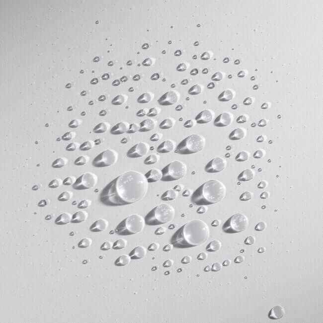 A close up of water droplets on a white surface: Simply Colour Hair Salon Studio & Online Store's Wella Professionals ULTIMATE REPAIR Miracle Hair Rescue.